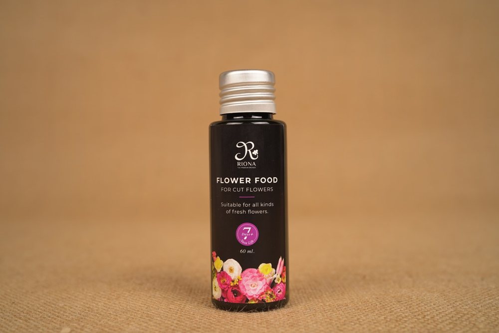 A 60 ml bottle of RIONA flower food