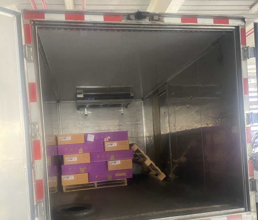 A pallet of our orchid cartons in a refrigerated truck at an airport cargo terminal in Taiwan